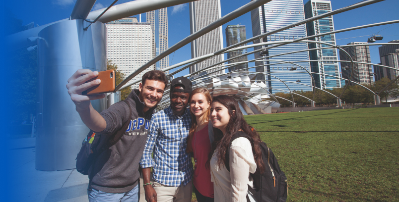 Four friends take a selfie under a metal sculpture in Millennium Park 